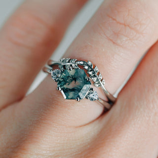Filigree Leaf Wedding Band in 14K White Gold paired with a unique hexagon moss agate and diamond ring on a hand, highlighting intricate nature-inspired elegance by Aquamarise Gold.