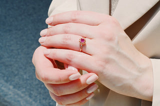 Vintage Ruby Ring in 14K Rose Gold Vermeil by Aquamarise, featuring a vibrant ruby set in an intricate rose gold band, worn on a hand against a soft neutral background.