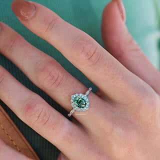 Cordelia Green Moss Agate Engagement Ring in Sterling Silver by Aquamarise, featuring a unique green moss agate center stone surrounded by sparkling accents on a delicate sterling silver band.
