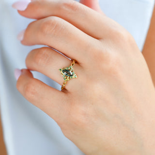 Fairy Queen moss agate and emerald lotus ring in yellow gold worn on a model's hand