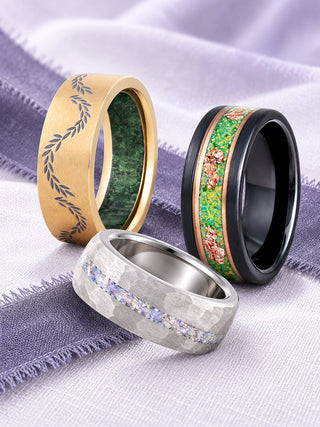 Men's wedding bands on white and heather silk: green moss agate leaf band in gold titanium, crushed moonstone band in silver tungsten and green fire opal rose gold leaf band in two-tone tungsten, Aquamarise banner
