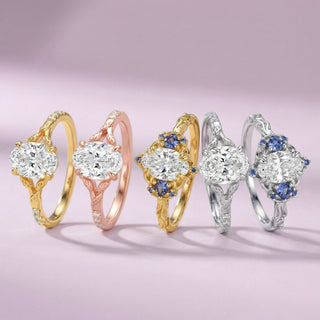 Five diamond rings in gold and silver on a pink background