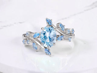 Moss agate leaf engagement ring by Aquamarise shown in a ring style banner