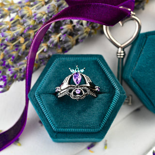Natural Amethyst Claddagh Engagement Ring Set in Black Ruthenium in a teal velvet ring box with a purple ribbon
