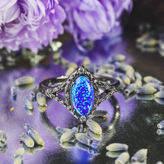 Nerida Lab-Grown Lavender Opal Engagement Ring in Black Ruthenium among lavender sprigs