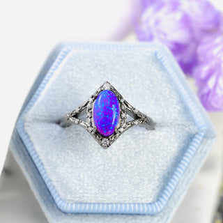 Nerida Lab-Grown Lavender Opal Engagement Ring in Black Ruthenium in a white velvet ring box