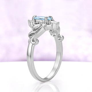 Profile of the Odette pear aquamarine tiara ring showing the raised crown setting and open scrollwork gallery in sterling silver