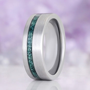 Men's 8mm brushed tungsten wedding band with a natural moss agate inlay set off-centre in the band