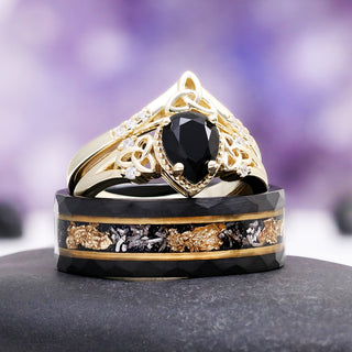 Black Onyx & Meteorite Celtic Couples Ring Set by Aquamarise, featuring a pear-shaped black onyx and meteorite inlay with gold accents in a Celtic-inspired design for matching couples rings.