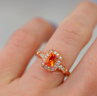 Vintage Halo Padparadscha Sapphire Ring in 14K Rose Gold Vermeil by Aquamarise, featuring an orange sapphire surrounded by diamond halo on a polished rose gold vermeil band.