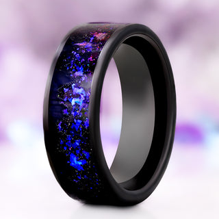 Orion Nebula & Trees men's wedding band in black tungsten carbide, 8mm, standing upright with black tree silhouettes against the purple and blue nebula opal inlay