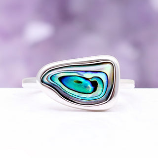 Close-up of the natural paua shell cabochon in its polished sterling silver bezel setting
