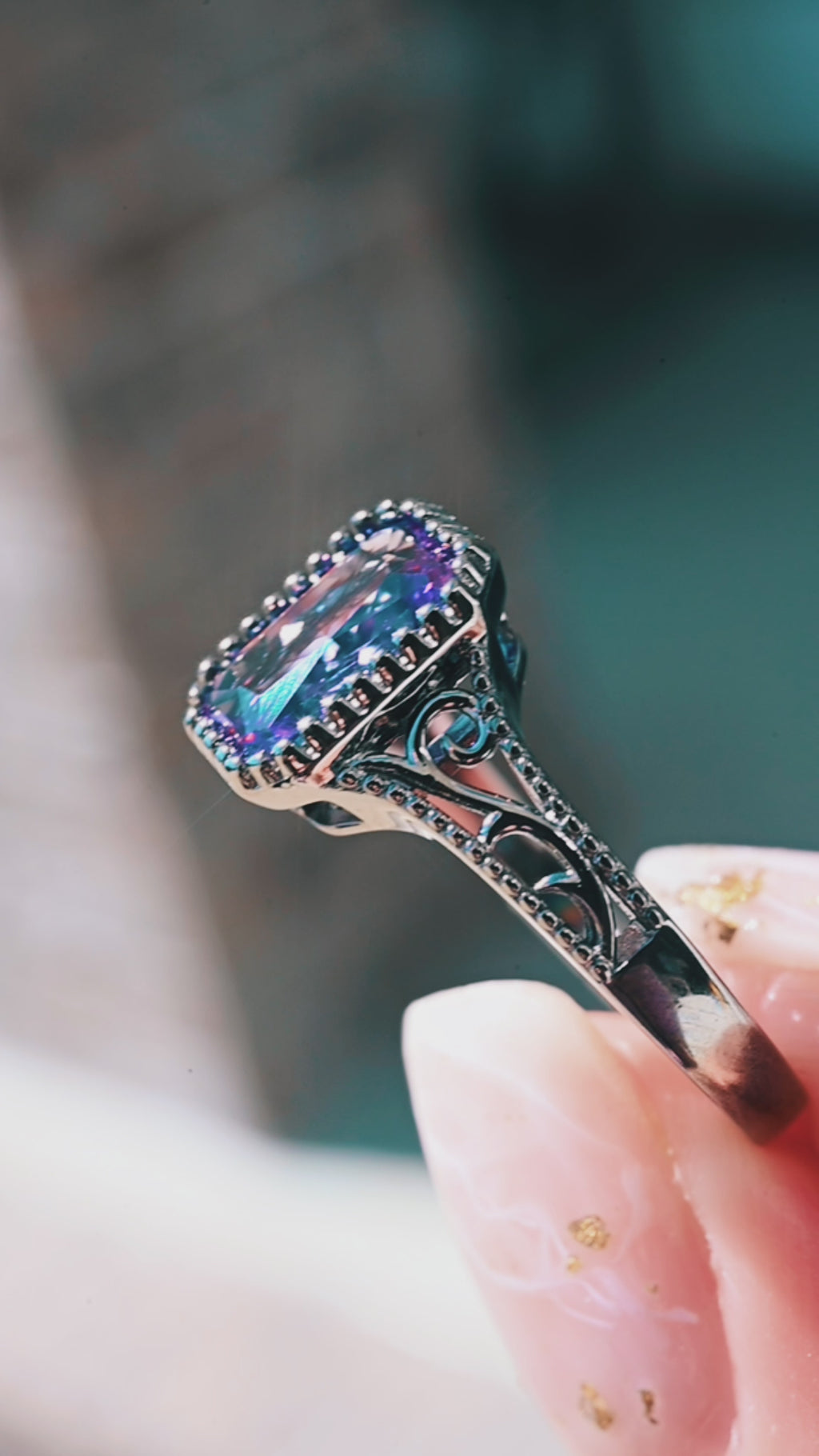 Video of a radiant cut alexandrite ring in black ruthenium by Aquamarise, shown in motion