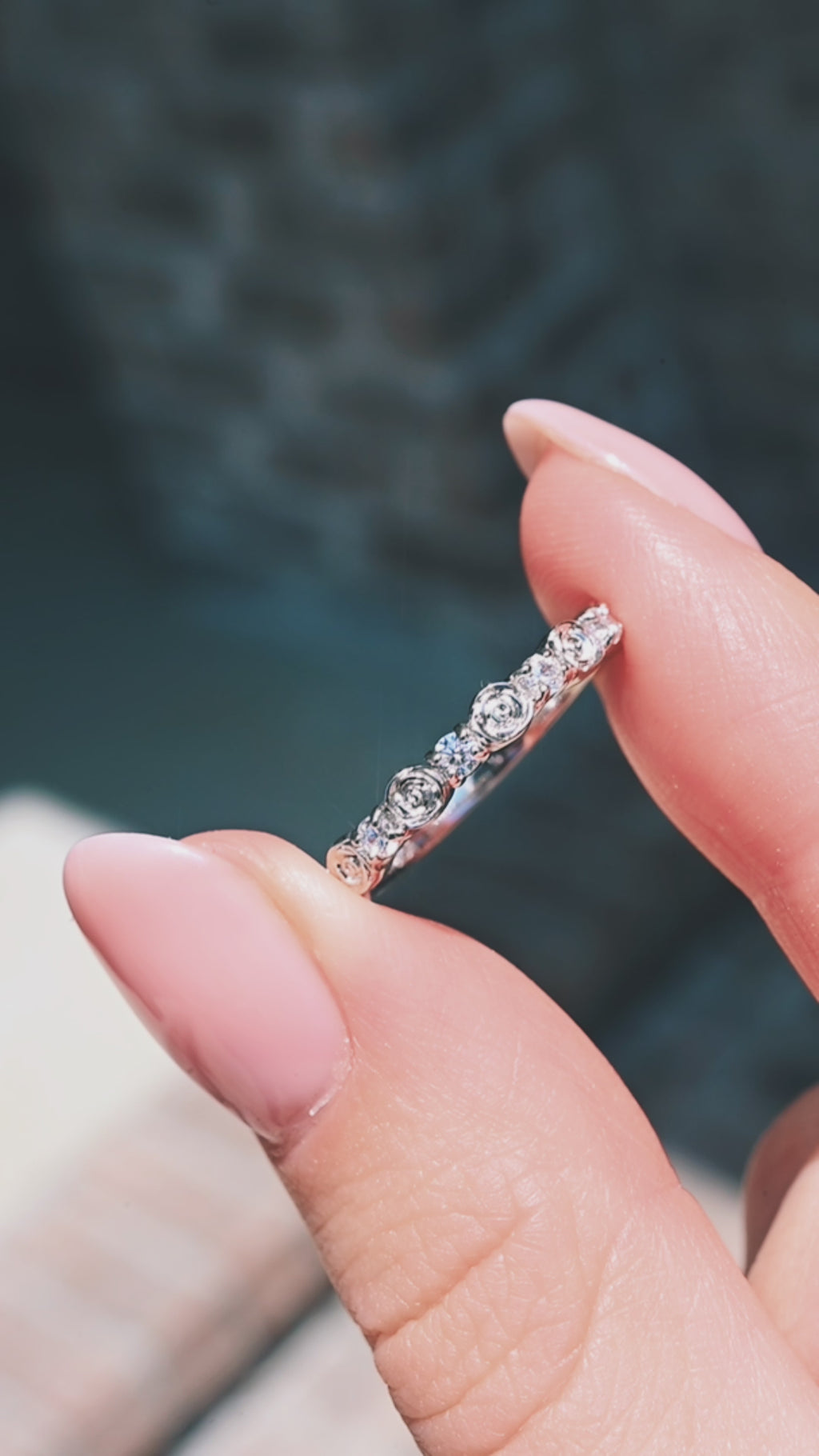 Video of a rose gold moissanite wedding band by Aquamarise, shown in motion