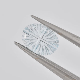 Natural Sky Blue Topaz oval 6 x 8 mm Faelight Cut video, turning to show the starburst flashes