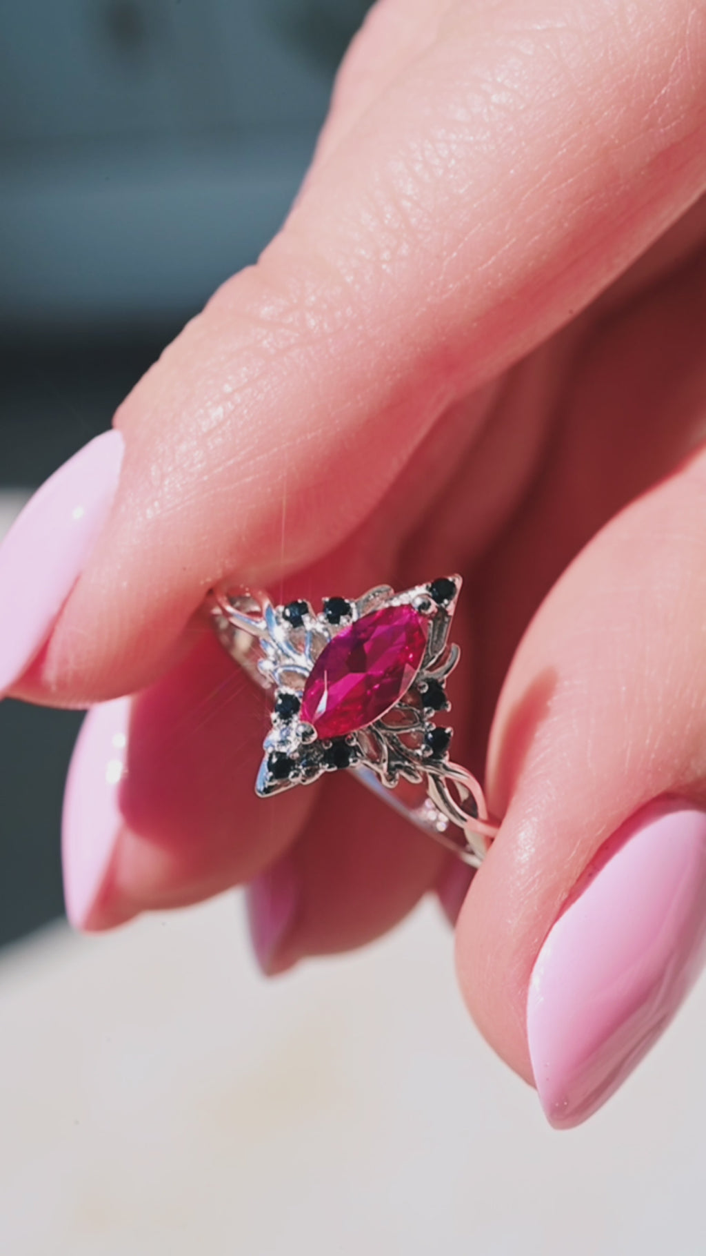 Video of the ruby and black onyx lotus ring by Aquamarise, shown in motion