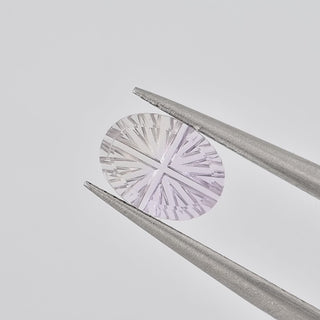Natural Ametrine oval 6 x 8 mm Faelight Cut video, turning to show the starburst flashes