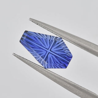Lab-Grown Blue Sapphire coffin 6 x 10 mm Faelight Cut video, turning to show the starburst flashes