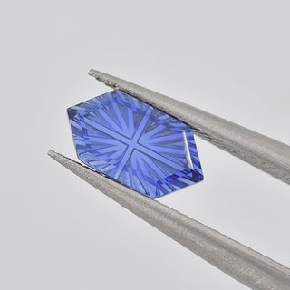 Lab-Grown Blue Sapphire long hexagon 6 x 10 mm Faelight Cut video, turning to show the starburst flashes