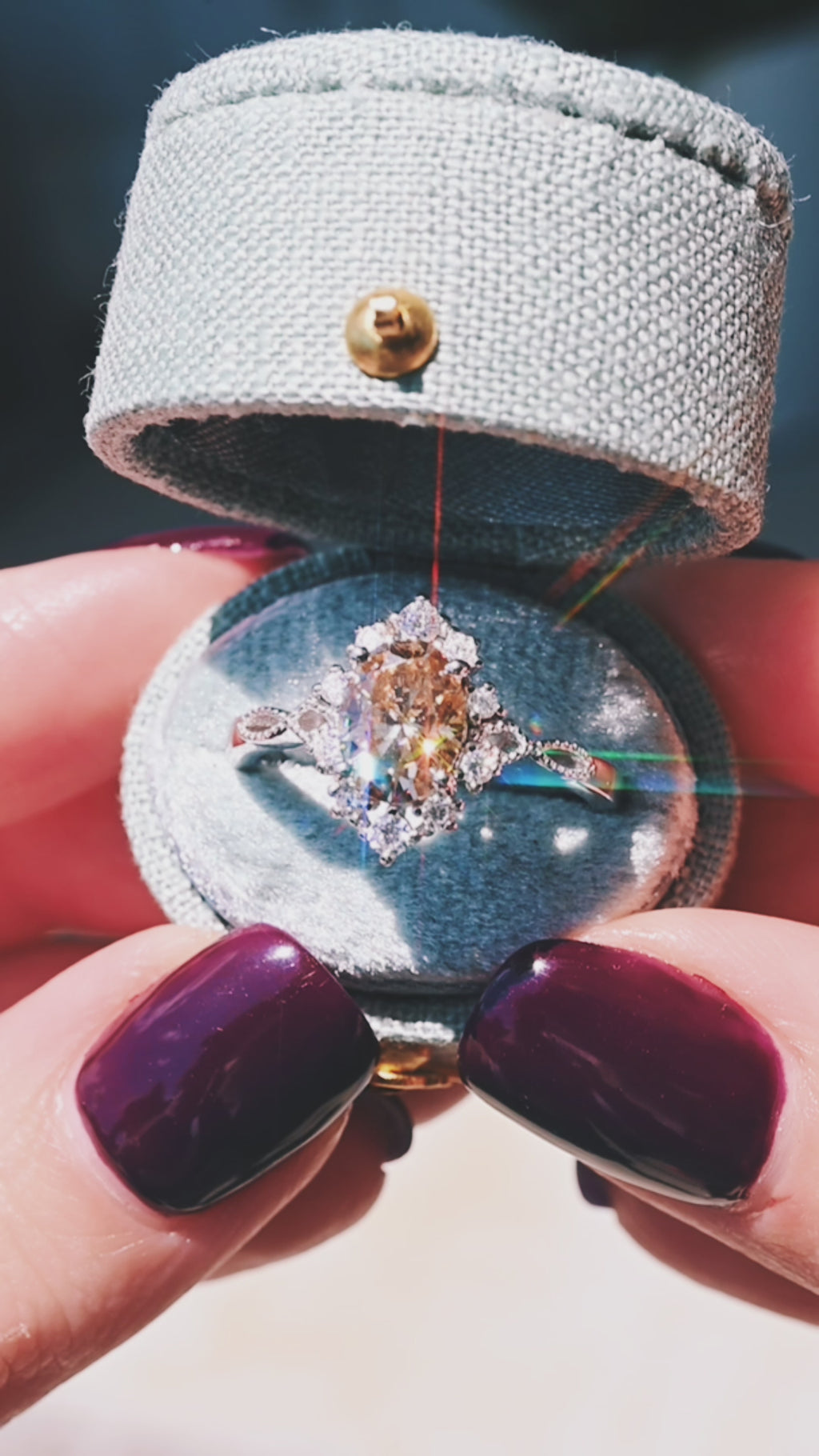 Video of a champagne moissanite engagement ring by Aquamarise, shown sparkling in motion