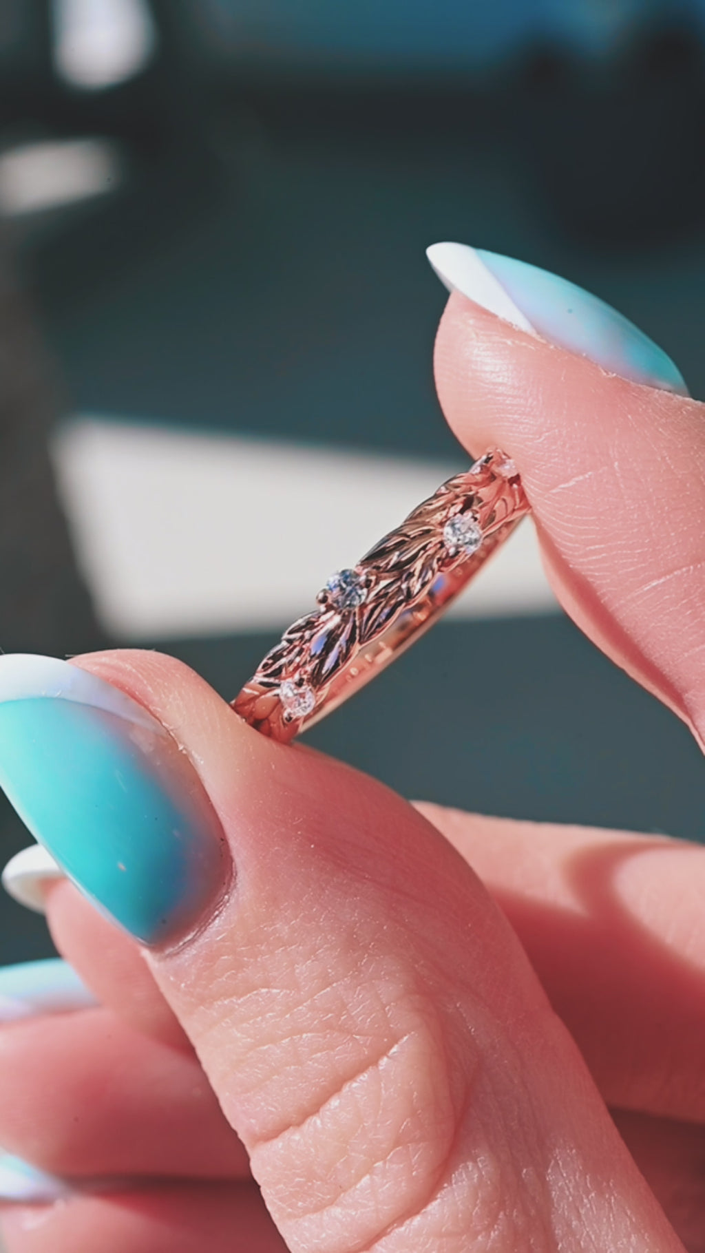 Product video of the Diamond Leaf Wedding Band in Solid 14K Rose Gold by Aquamarise, showing the diamond-set leaf detailing along the band.
