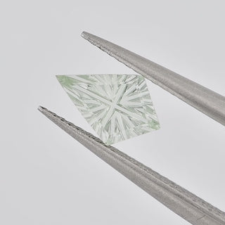 Lab-Grown Green Sapphire kite 6 x 9 mm Faelight Cut video, turning to show the starburst flashes