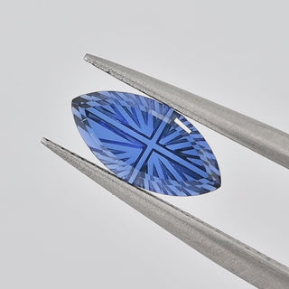 Lab-Grown Blue Sapphire marquise 5 x 10 mm Faelight Cut video, turning to show the starburst flashes