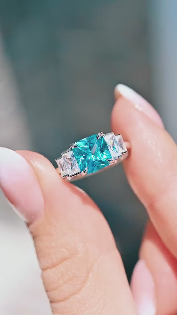 Video of the Art Deco Teal Sapphire Engagement Ring in Sterling Silver by Aquamarise, showing the teal sapphire sparkle