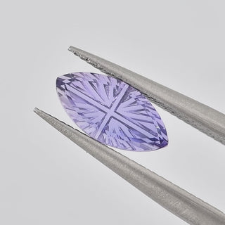 Lab-Grown Lavender Purple Sapphire marquise 5 x 10 mm Faelight Cut video, turning to show the starburst flashes