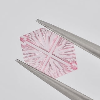 Lab-Grown Pink Sapphire long hexagon 5 x 9 mm Faelight Cut video, turning to show the starburst flashes