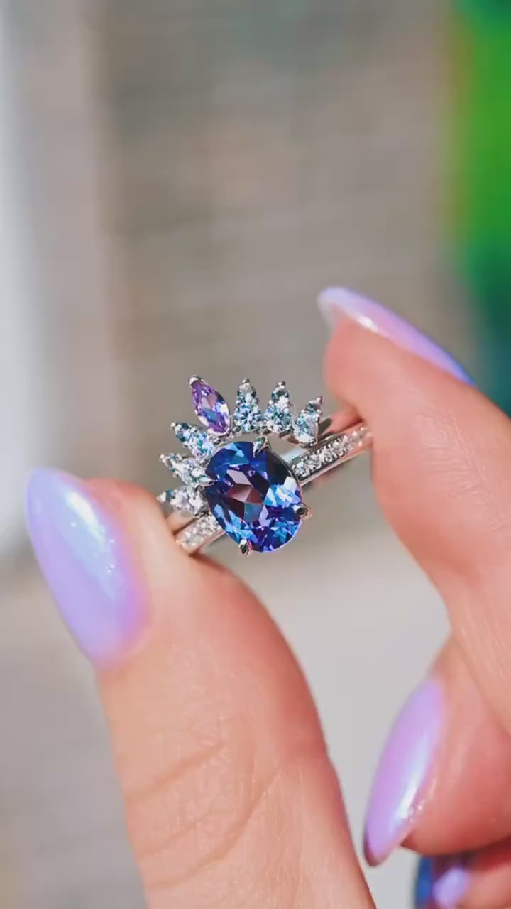 Video of the Alexandrite Curved Wedding Band in Sterling Silver by Aquamarise, shown sparkling in motion