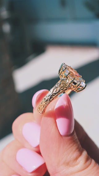 Product video of the Marquise Victorian Gothic Filigree Engagement Ring in Solid 14K Yellow Gold by Aquamarise, showing the marquise diamond within scrollwork filigree.