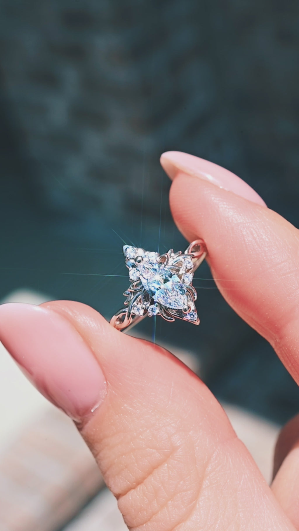 Video of the marquise butterfly and lotus engagement ring in 14K white gold by Aquamarise Gold, shown sparkling in motion