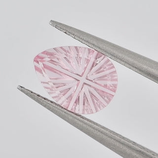 Lab-Grown Pink Sapphire pear 6 x 8 mm Faelight Cut video, turning to show the starburst flashes