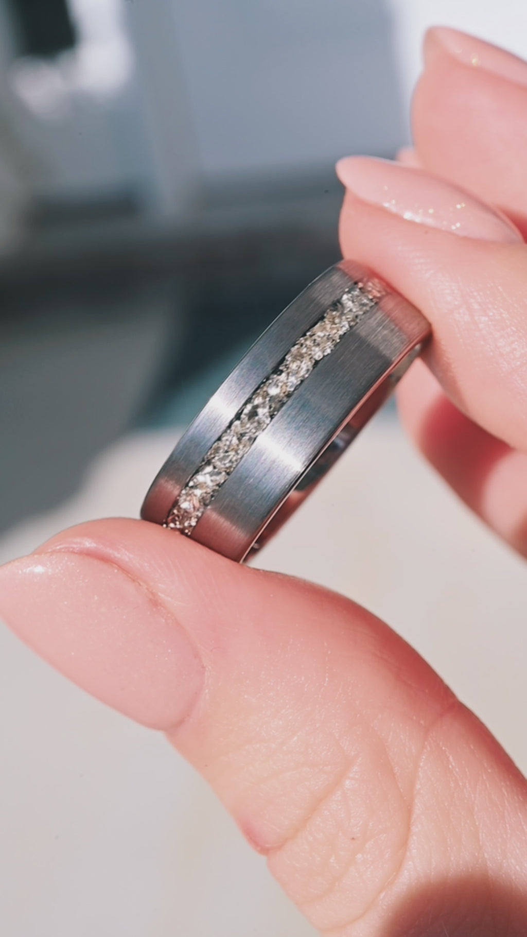 Video of a crushed diamond men's tungsten ring by Aquamarise, shown in motion