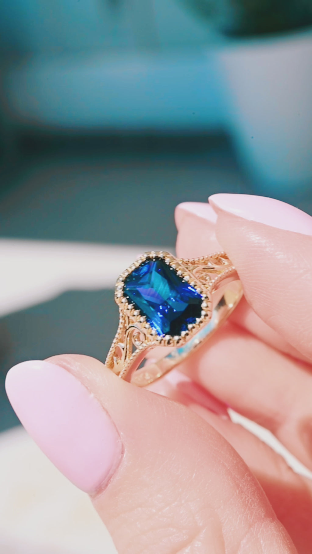 Video of a vintage bezel set sapphire ring in gold by Aquamarise, shown in motion