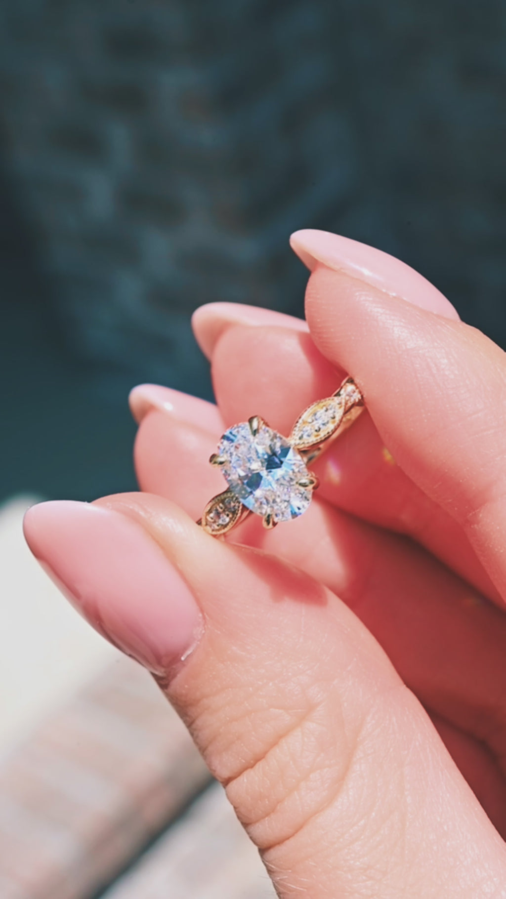 Video of a milgrain oval cut diamond ring in gold by Aquamarise Gold, shown in motion