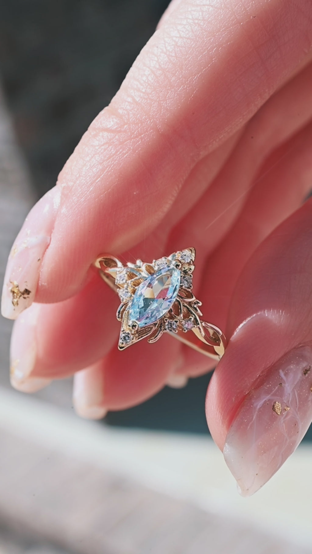 Video of the aquamarine lotus ring in gold by Aquamarise, shown in motion
