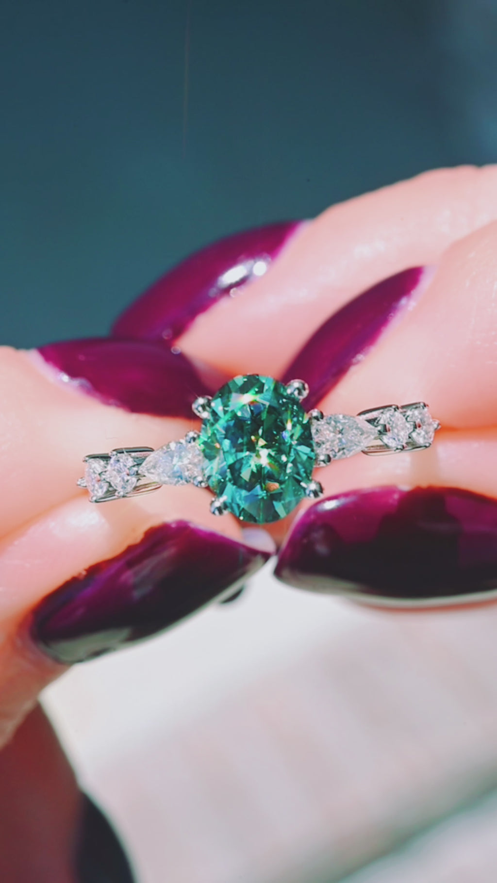 Product video of the Green Moissanite Engagement Ring in 14K White Gold by Aquamarise, showing the green moissanite center stone.