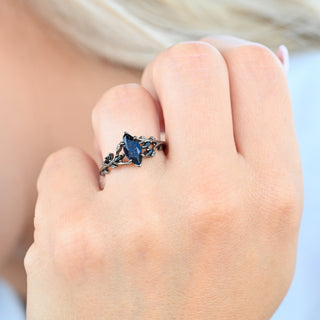 Second angle of the Rowan Starry Night marquise ring with black onyx leaves on the finger