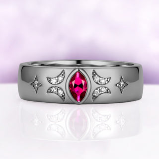 6mm black ruthenium wedding band with a bezel-set marquise lab-grown ruby flanked by pave crescent moons and four-point stars