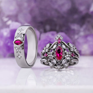 Ruby Celestial 6mm wedding band with moon and star details standing beside the matching Nightbriar ruby bridal ring set in black ruthenium