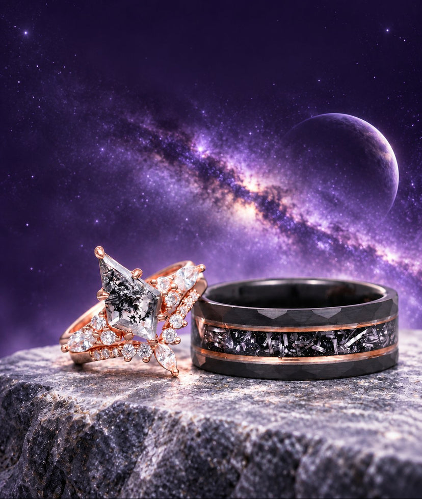 Skye Kite galaxy Herkimer diamond ring set in rose gold beside a black tungsten meteorite band with rose gold edges on stone under a starry night sky, Aquamarise couples ring set banner