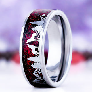 Starry Night wolf and trees men's wedding band in silver tungsten, 8mm, standing view showing the wolf and pine silhouettes over the red galaxy inlay