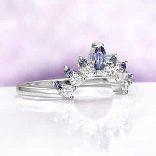 Alexandrite Curved Wedding Band in Sterling Silver by Aquamarise, featuring a marquise-cut alexandrite surrounded by sparkling white and blue stones on a gracefully curved sterling silver band.