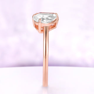 Profile view of the Toi Et Moi morganite and moissanite ring in 14K rose gold, showing the pear moissanite basket setting and slim band