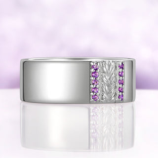 Angled view of the Viridian Leaf & Amethyst men's wedding band in sterling silver showing the leaf relief and five amethysts per channel