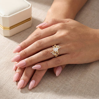 Gold ring with a diamond on a hand, with a beige background