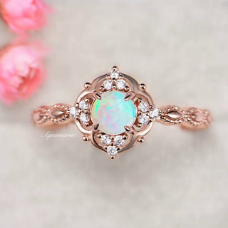 Natural Australian Opal Ring in 14K Rose Gold Vermeil by Aquamarise, featuring a glowing opal center with delicate floral motifs and pavé-set simulated diamonds in a vintage-inspired promise ring design.