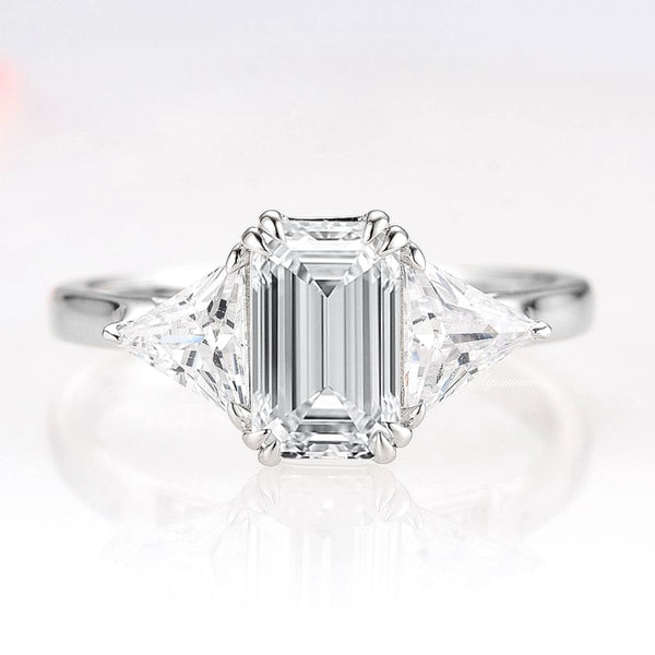 Emerald Cut Lab-Grown Diamond Engagement Ring- 14K White Gold (IGI Certified) by Aquamarise Gold, featuring a three-stone design with trillion side diamonds for timeless elegance.